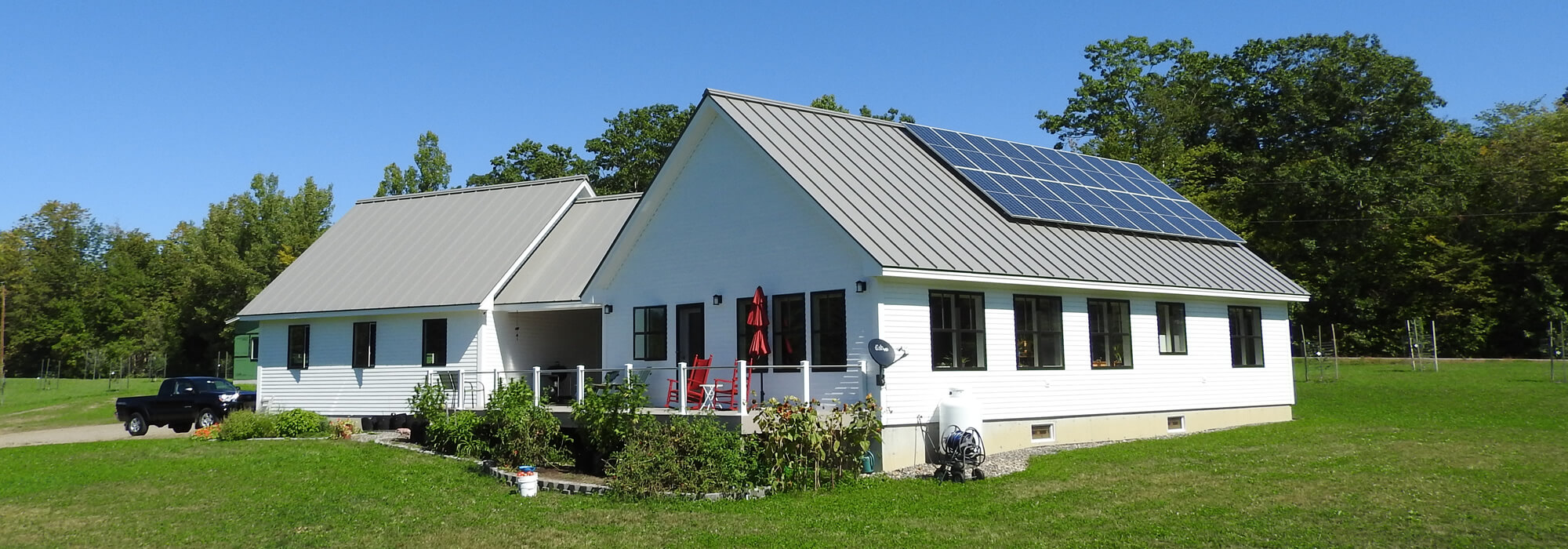 Banner of new home with solar panels.